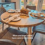 Solid Oak Round Dining Table With Wooden Legs and Leather Chairs
